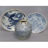 A Chinese blue and white deep plate decorated with a dragon and two other items