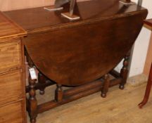 An oak gateleg table W.108cm