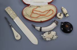 An ivory dog whistle, carved paper knife, coral necklace etc.