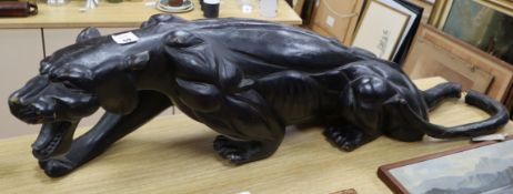 A carved ebonised panther
