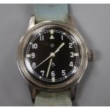A gentleman's mid 20th century stainless steel military black dial manual wind wrist watch, case