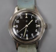 A gentleman's mid 20th century stainless steel military black dial manual wind wrist watch, case