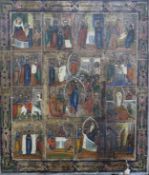 A late 19th century Eastern European icon, tempera on wood, decorated with scenes from the life of