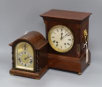 A mahogany-cased mantel clock with brass lion mask and ring handles and a small oak-cased mantel