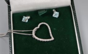 A 14k white metal and diamond heart pendant on 9ct chain and a pair of 9k and gem set ear studs.