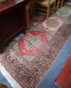 A Persian pattern rose ground cotton and silk rug 298 x 215cm