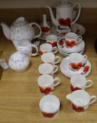 A collection of Wedgwood Susie Cooper Corn Poppy tableware and a blue spot teapot, milk jug and