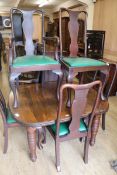 A Victorian mahogany extending dining table and six George III style dining chairs W.122cm