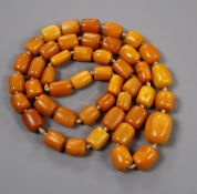 A single strand graduated barrel shaped amber bead necklace, gross 126 grams, 98cm.