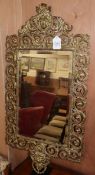 A gilt metal wall mirror.