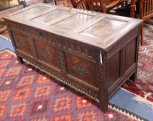 An 18th century oak panelled coffer, W.146cm