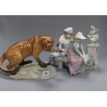 A Beswick model mountain lion and a Nao figure group