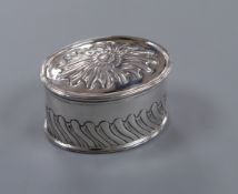 A George III repousse silver oval box and cover, Hannah Northcote, London, 1802, 77mm.