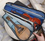 A cased violin and mandolin