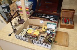 A collection of professional watch makers tools and reference books
