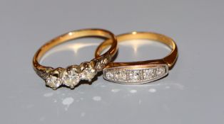 An 18ct & Pt set graduated five stone diamond ring and a yellow metal and three stone diamond ring.