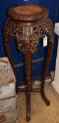 A Chinese carved hardwood marble topped jardiniere stand H.94cm
