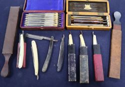 A collection of cut throat razors some cased and strops