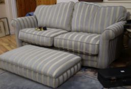 A modern upholstered striped fabric two seater sofa and footstool W.190cm and 110cm