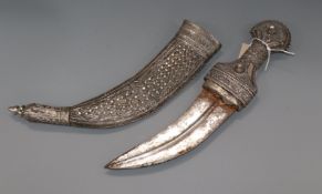 A white metal overlaid dagger