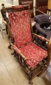 A late Victorian turned walnut rocking armchair