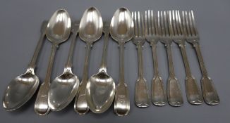 A set of six Victorian silver fiddle and thread pattern tablespoons and five matching table forks,