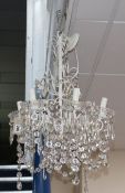 A six branch white painted electrolier with hung cut glass drops