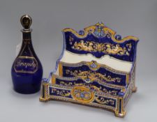 A Faience desk stand and a Bristol blue brandy decanter