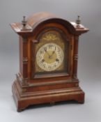 A 1920's dome topped mahogany cased mantle clock, height 35.5cm.