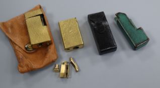 Three Dunhill lighter cases and two lighter bodies