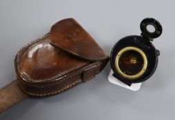 A WWI military prismatic compass in leather case