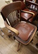 An Edwardian oak swivel desk chair
