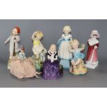 A collection of Royal Worcester figurines, two Doulton figures and a pin dolly