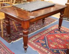 An early 19th century mahogany writing table with cross banded top W.144cm