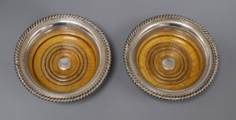 A pair of Victorian plated bottle coasters