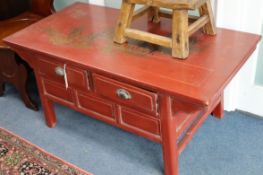 A Chinese red lacquer two drawer low table W.117cm