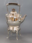 A silver-plated Elkingtons kettle on stand