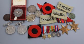 A quantity of medals, coins and badges