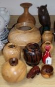 A collection of turned wood vases, carvings, some signed (12) Tallest 26cm