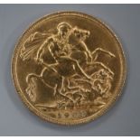 An Edward VII 1909 gold full sovereign.