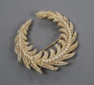 A Regency seed pearl set mother of pearl spray brooch, (repair), 55mm.