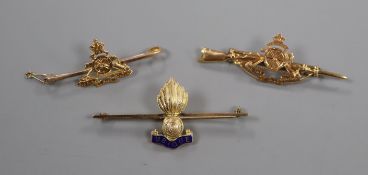 Three early-mid 20th century 9ct Royal Artillery bar brooches, one with enamel.