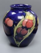 A Moorcroft blue ground Wisteria pattern vase height 22cm