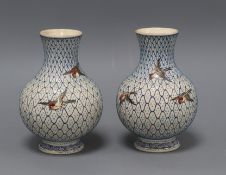 A pair of Japanese earthenware vases, impressed mark height 14.5cm