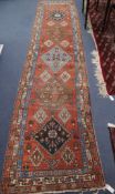 A Caucasian red ground runner 380 x 84cm