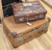 A red leather lined suitcase with 1930's labels, a trunk and laundry box