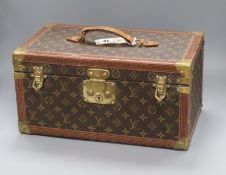 A Louis Vuitton vanity case, serial number 949439 (mirror damaged)