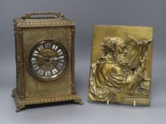 A German brass portrait plaque and a brass mantel clock