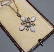 A late Victorian yellow and white metal, white opal and diamond set quatrefoil pendant, on a later