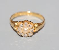A late Victorian 18ct gold, rose cut diamond and split pearl set cluster ring, size O.